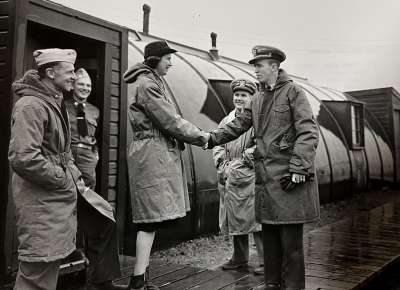 Marguerite Hunold is greeted by Lieutenant Commander Vincent Albert Sweeney
