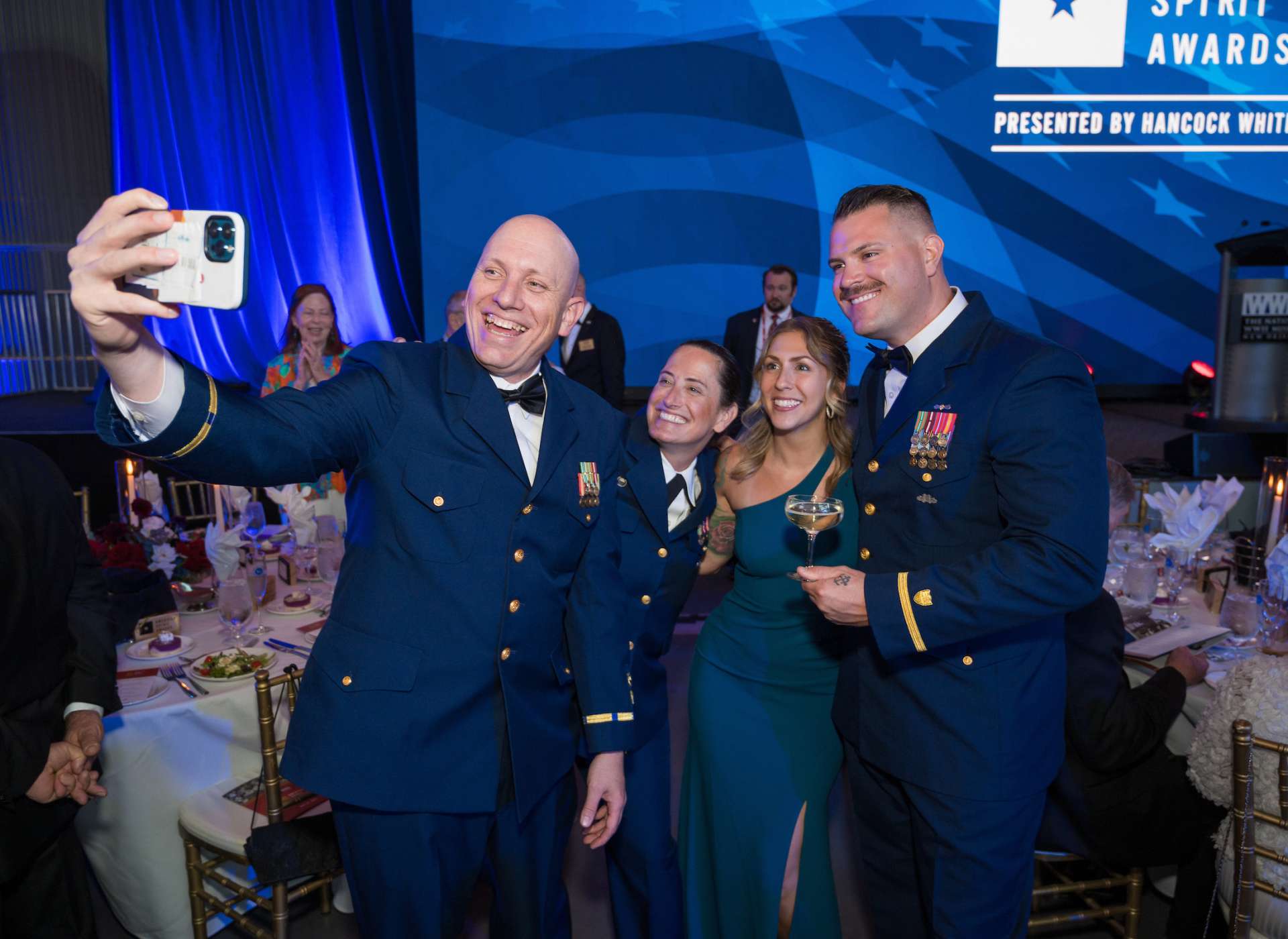 Guests take a photo at the 2024 American Spirit Awards Gala.