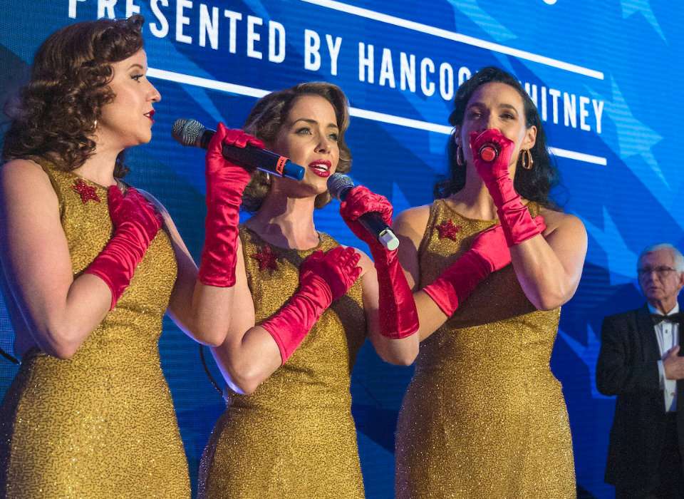 Victory Belles sing the national anthem