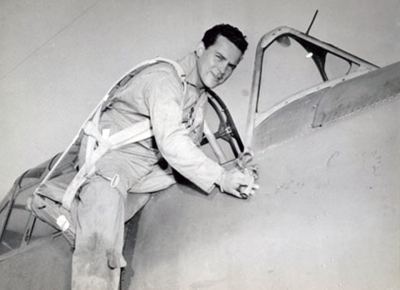 Arthur Van Haren sits atop his Vultee trainer aircraft. 